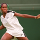Venus Williams, her hair beaded in the Wimbledon colors, on June 28, 1997, at the Wimbledon Championships (Frank Leonhardt/AFP/Getty Images)
